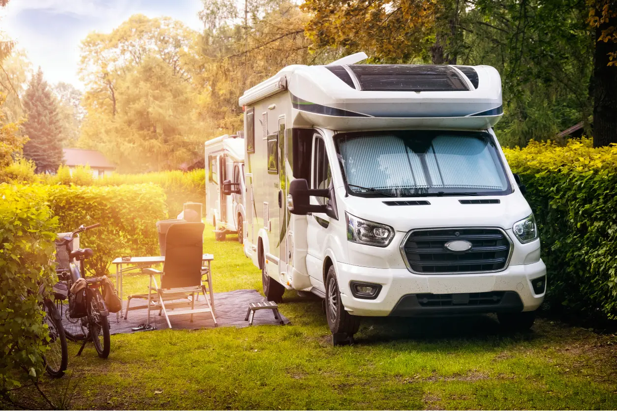 New Project(7) Camper van parked in a scenic campsite.