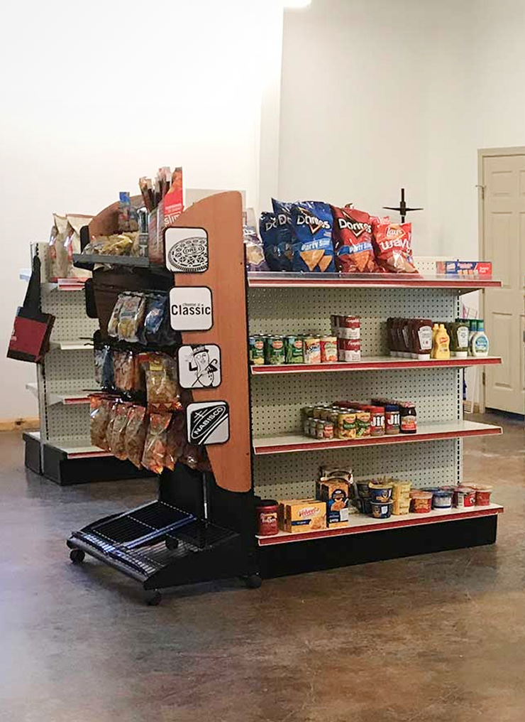 image Store shelves with snacks and canned goods.